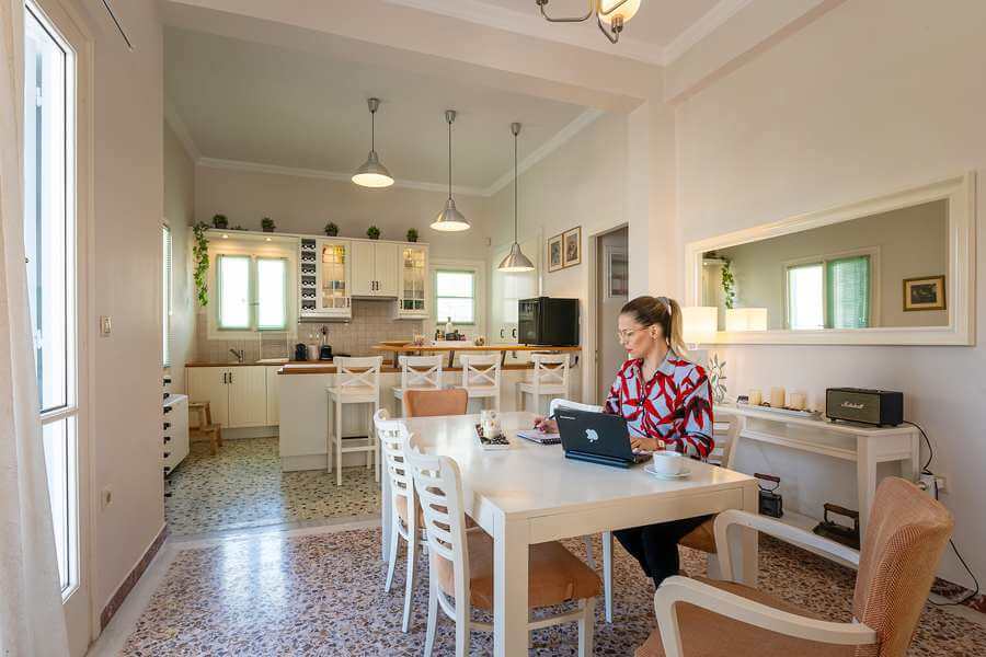 Guest Enjoys Beautiful Moments in the Dining room of the rented villa ANGELINAS QUARTERS
